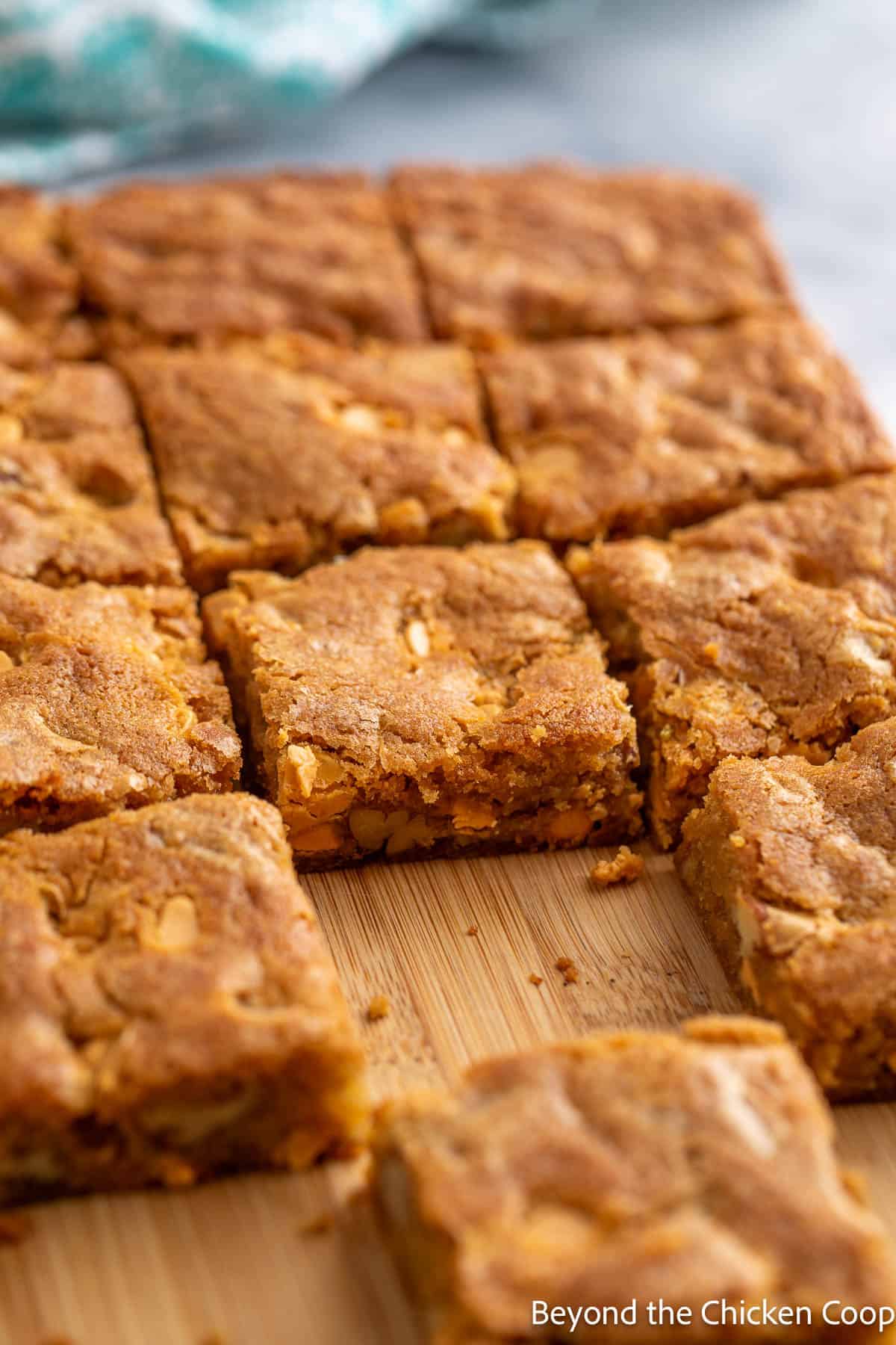 Butterscotch brownie bars on a wooden board. 