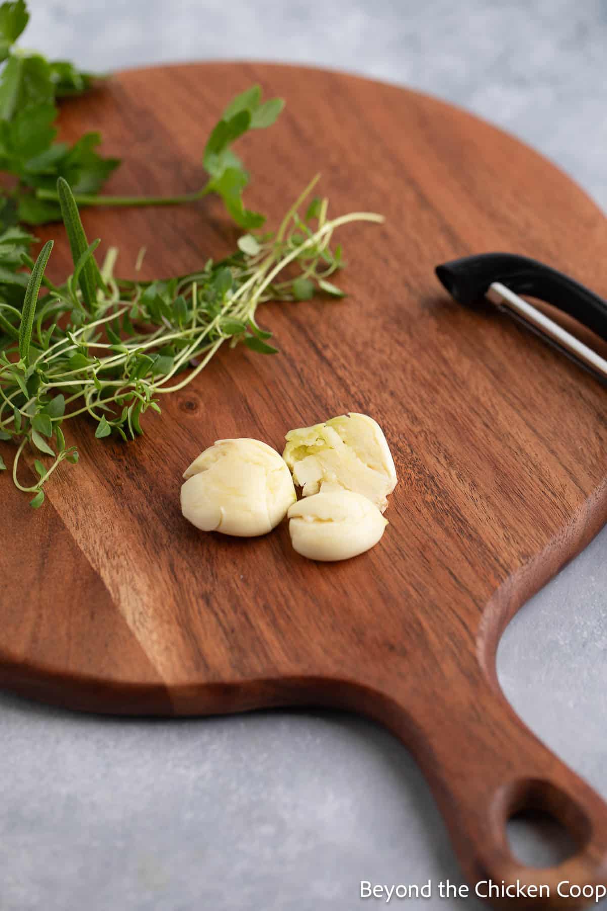 Smashed garlic on a wooden board. 