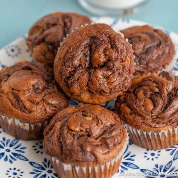 Banana Nutella Muffins on a blue and white plate.