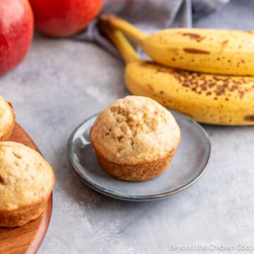 An apple banana muffin on a small blue plate.