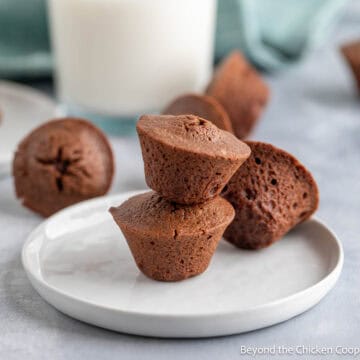 Brownie bites stacked on a plate.